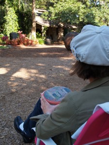 Jean painting an oval wood block