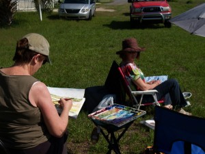 Jean and Pat painting the scene