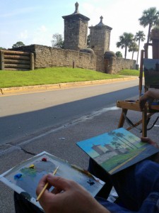 Michael finishing his painting from last week